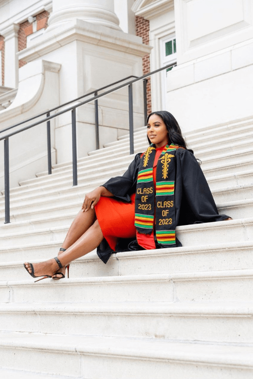 Woman wearing a figure flattering Grace Bandage Midi Dress - Classic Black Bodycon Collection