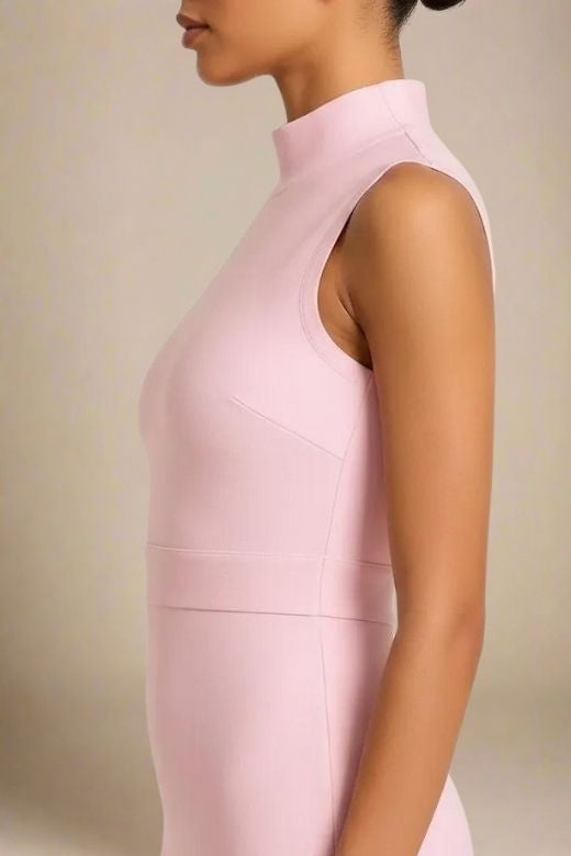 Woman wearing a figure flattering Grace Bandage Midi Dress - Dusty Pink Bodycon Collection