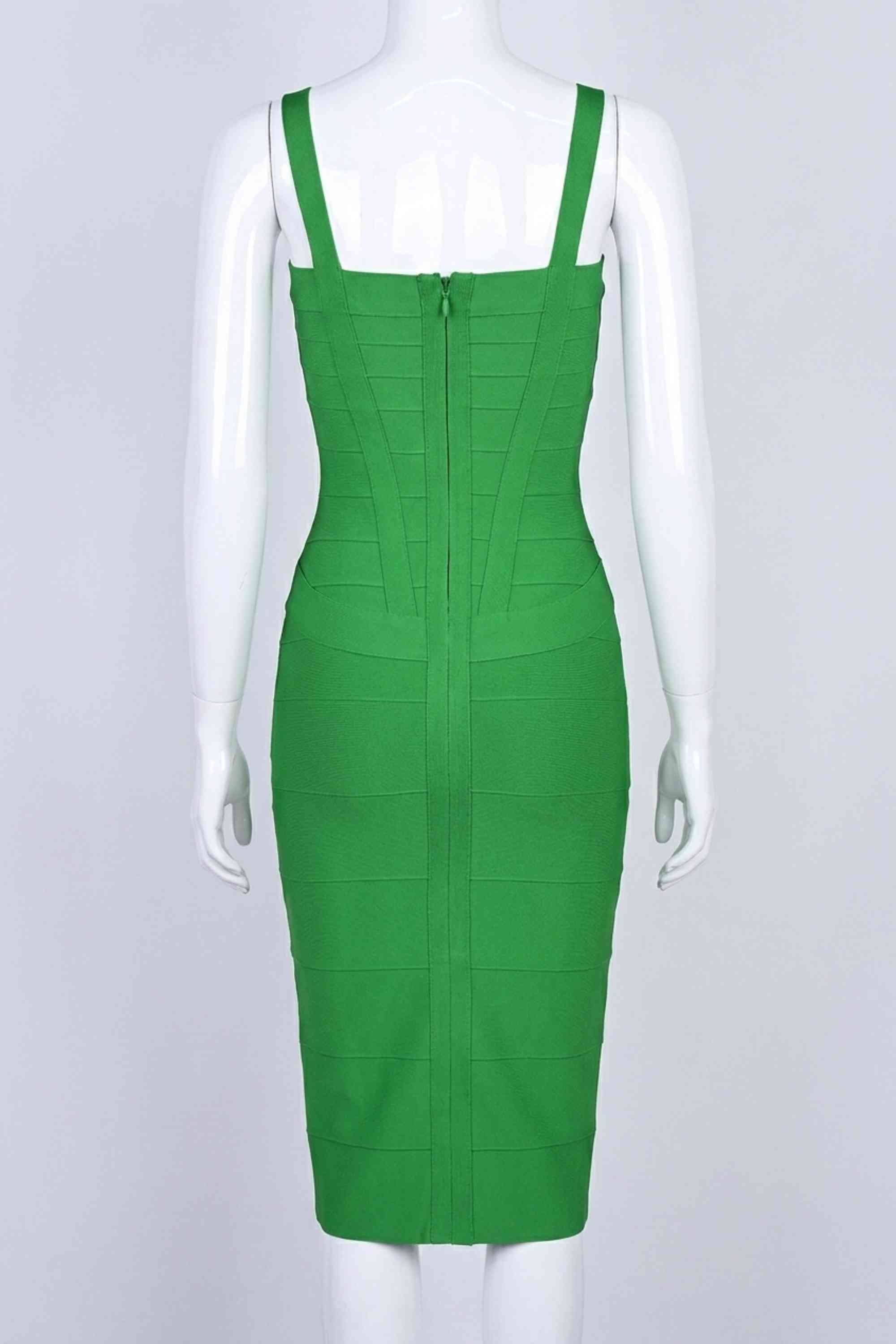Woman wearing a figure flattering Heidi Bandage Midi Dress - Emerald Green Bodycon Collection