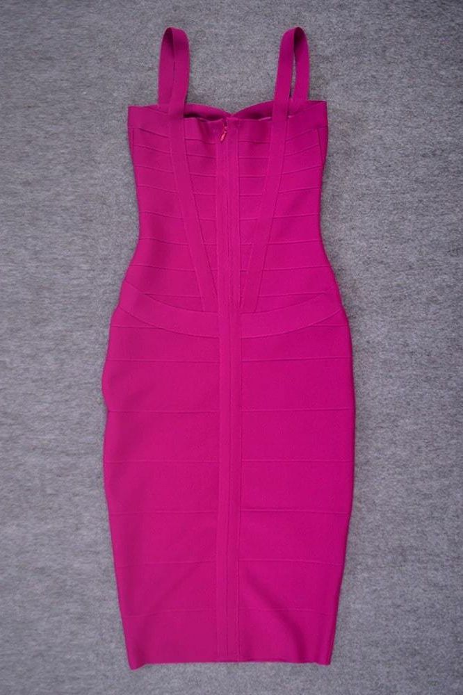 Woman wearing a figure flattering Heidi Bandage Midi Dress - Magenta Pink Bodycon Collection