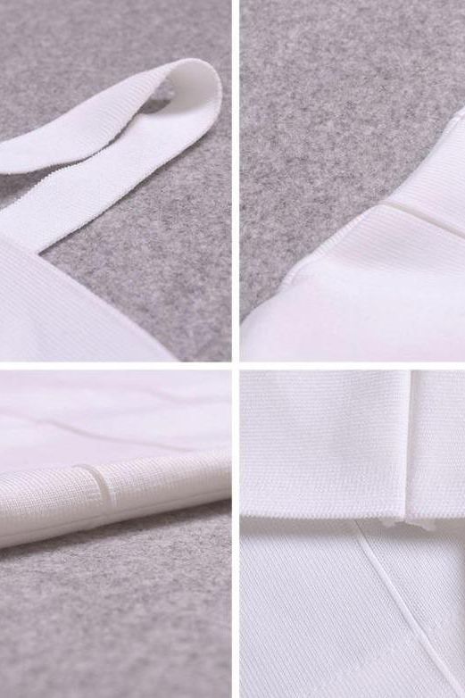 Woman wearing a figure flattering Heidi Bandage Midi Dress - Pearl White Bodycon Collection