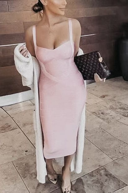 Woman wearing a figure flattering Heidi Bandage Midi Dress - Sky Blue Bodycon Collection