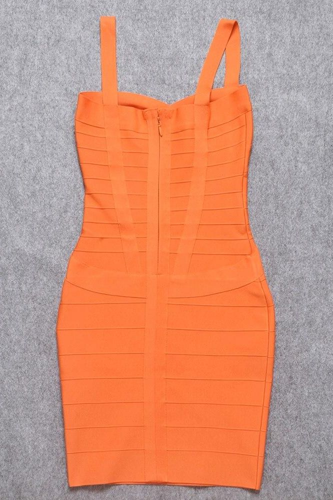 Woman wearing a figure flattering Heidi Bandage Mini Dress - Apricot Orange Bodycon Collection