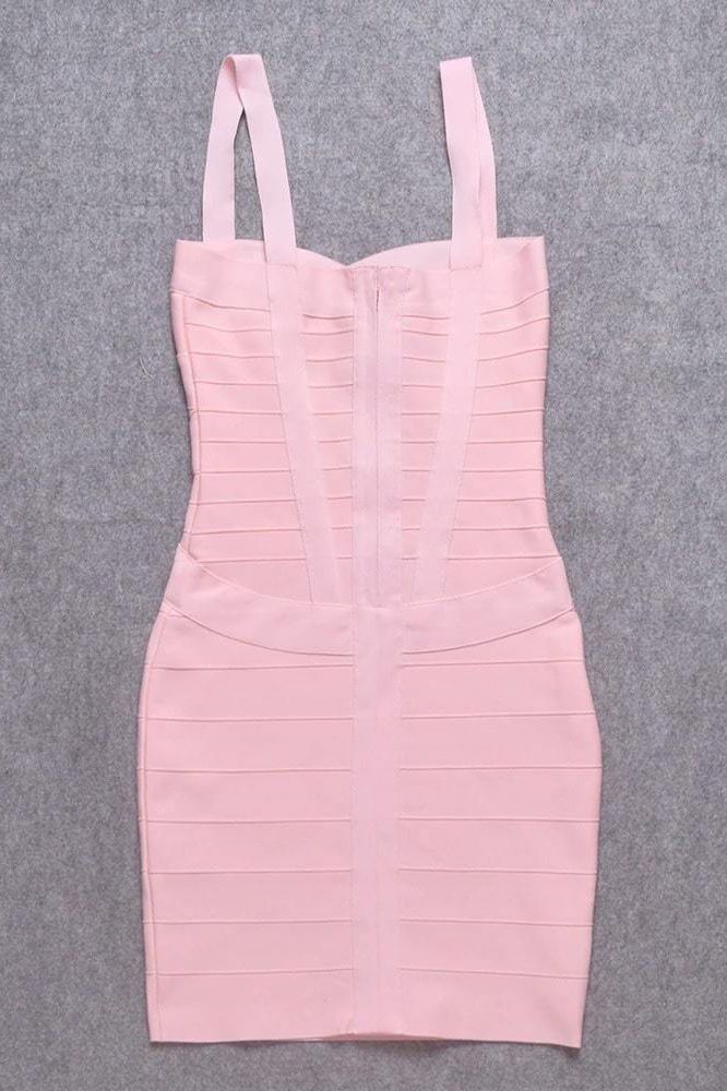 Woman wearing a figure flattering Heidi Bandage Mini Dress - Dusty Pink Bodycon Collection