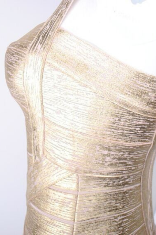 Woman wearing a figure flattering Heidi Bandage Mini Dress - Gold Bodycon Collection