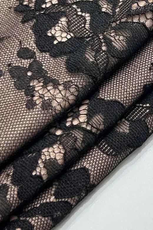 Woman wearing a figure flattering Joan Bodycon Dress - Classic Black BODYCON COLLECTION