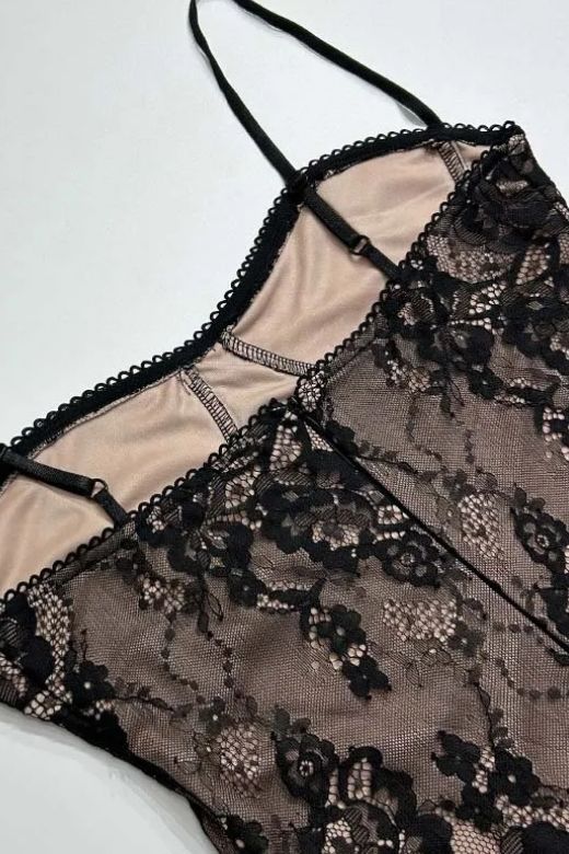 Woman wearing a figure flattering Joan Bodycon Dress - Classic Black BODYCON COLLECTION