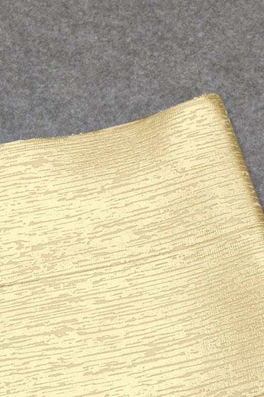 Woman wearing a figure flattering High Waist Bandage Mini Skirt - Metallic Gold BODYCON COLLECTION