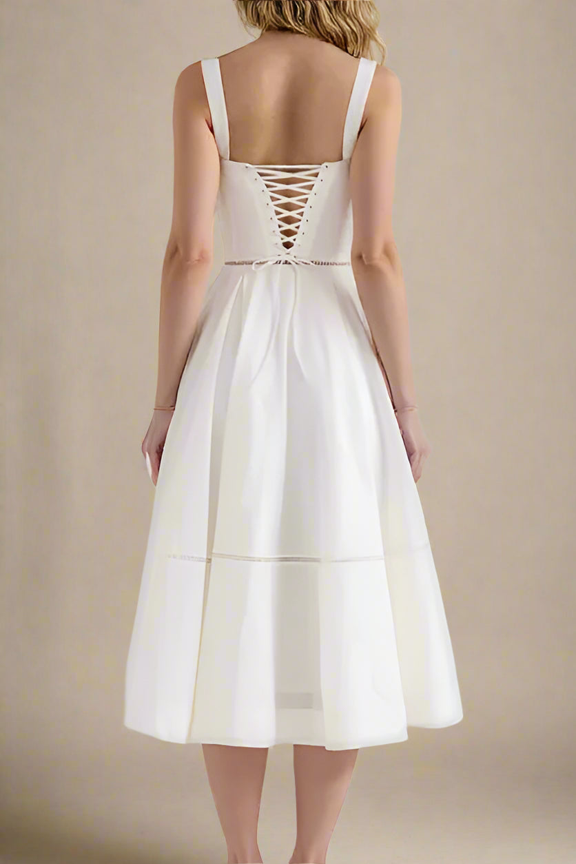 Woman wearing a figure flattering Holland Top and Midi Skirt Set - White Pearl BODYCON COLLECTION Pty Ltd