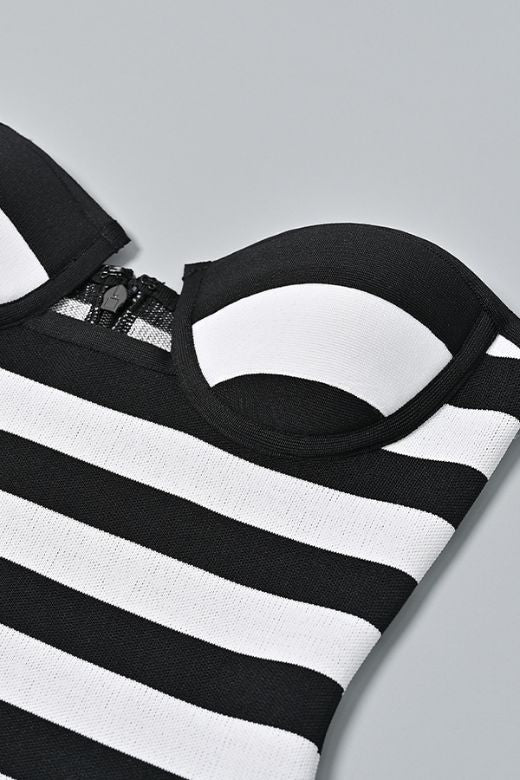 Woman wearing a figure flattering Ingrid Bandage Mini Dress - Classic Black BODYCON COLLECTION