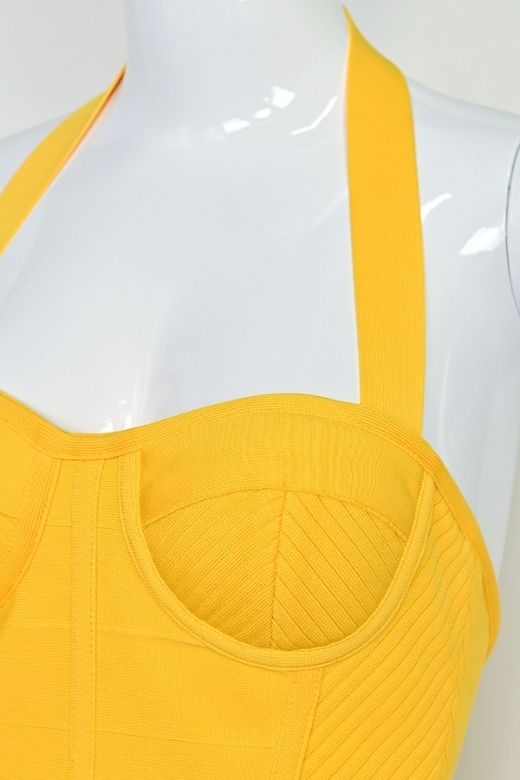 Woman wearing a figure flattering Isabella Bandage Midi Dress - Mustard Yellow BODYCON COLLECTION Pty Ltd