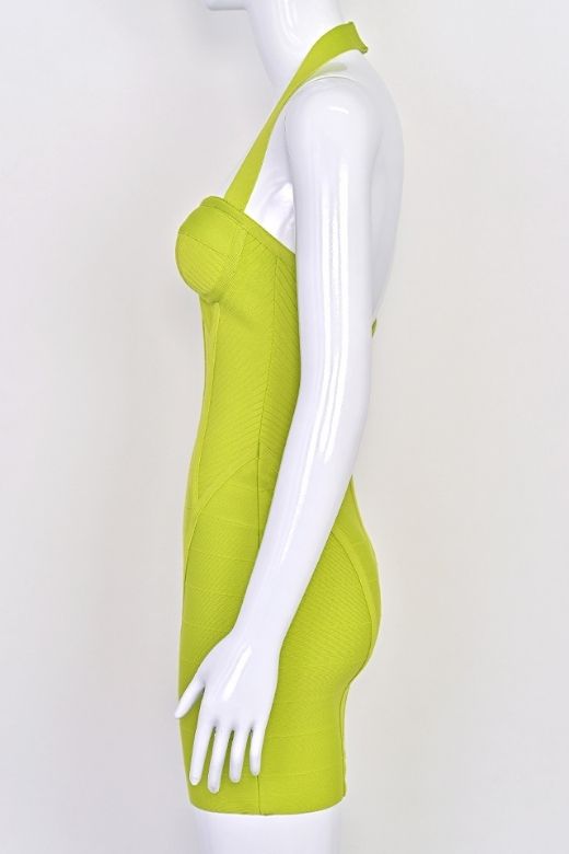 Woman wearing a figure flattering Isabella Bandage Mini Dress - Neon Green BODYCON COLLECTION Pty Ltd