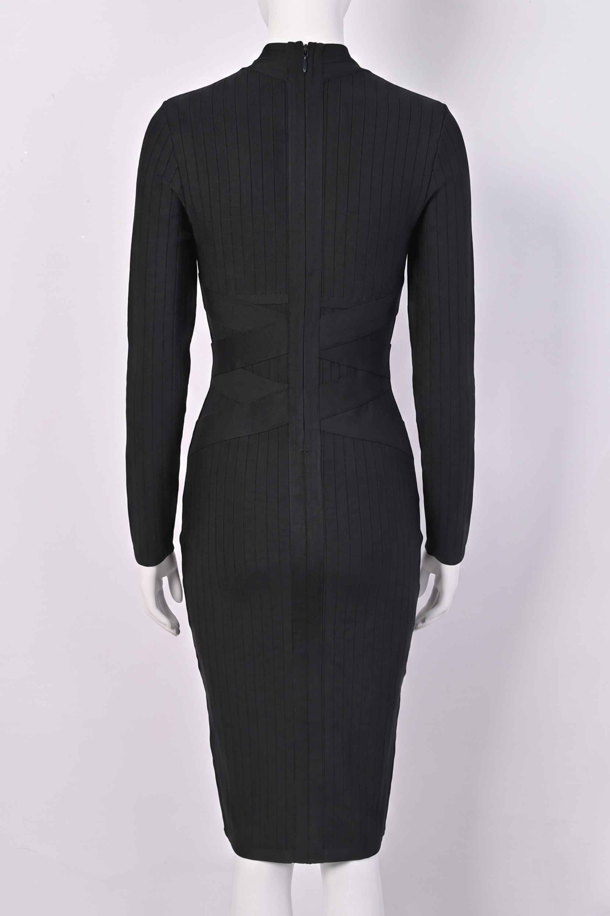 Woman wearing a figure flattering Jane Long Sleeve Bodycon Midi Dress - Classic Black Bodycon Collection