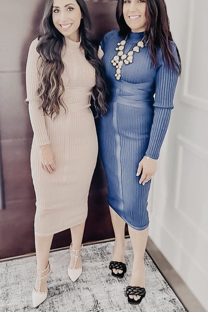 Woman wearing a figure flattering Jane Long Sleeve Bodycon Midi Dress - Classic Black Bodycon Collection