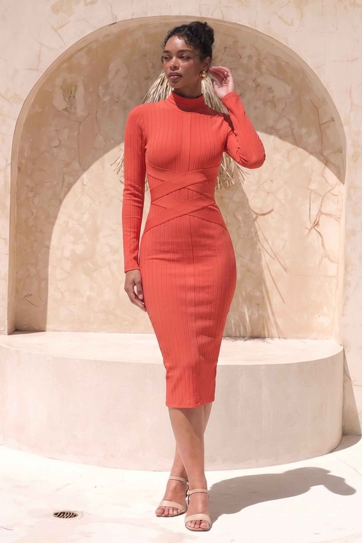 Woman wearing a figure flattering Jane Long Sleeve Bodycon Midi Dress - Lipstick Red Bodycon Collection