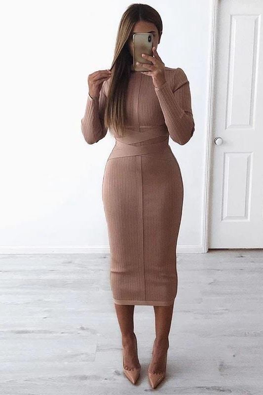 Woman wearing a figure flattering Jane Long Sleeve Bodycon Midi Dress - Nude Bodycon Collection