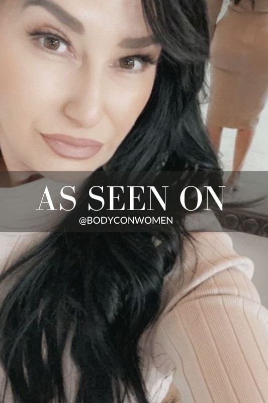 Woman wearing a figure flattering Jane Long Sleeve Bodycon Midi Dress - Nude Bodycon Collection