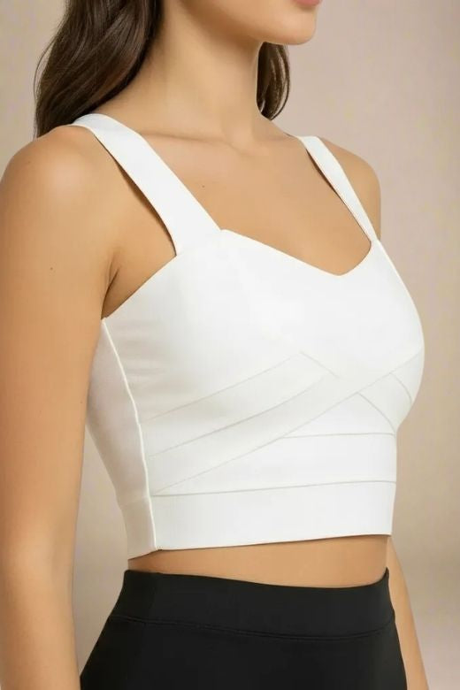 Woman wearing a figure flattering Jay Bandage Crop Top - Pearl White BODYCON COLLECTION
