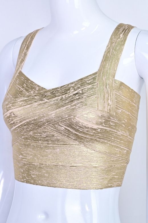 Woman wearing a figure flattering Jay Bandage Leather Crop Top - Gold BODYCON COLLECTION