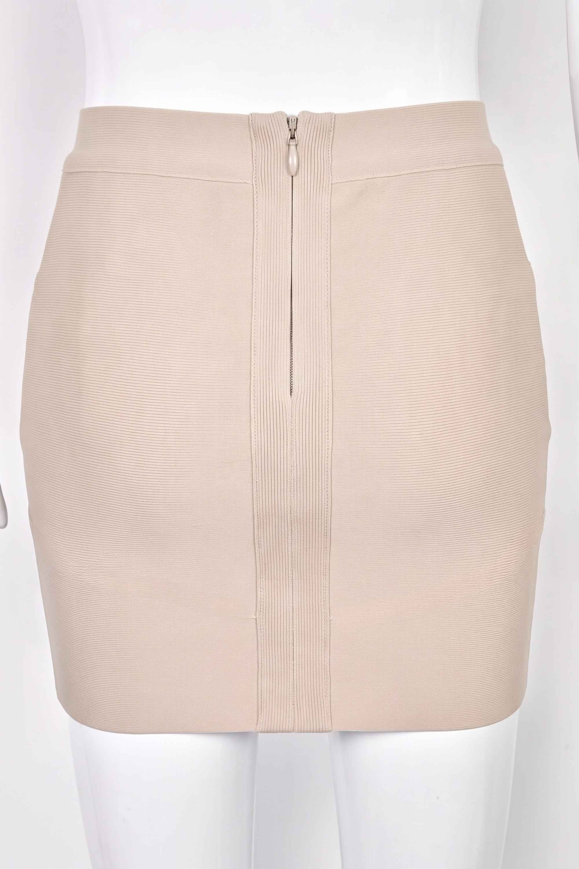 Woman wearing a figure flattering Jay High Waist Bandage Mini Skirt - Cream BODYCON COLLECTION