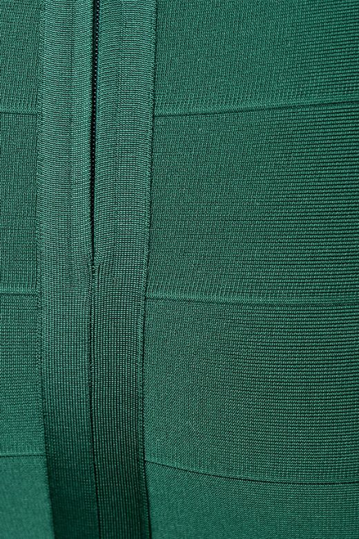 Woman wearing a figure flattering Jene Bandage Dress - Emerald Green BODYCON COLLECTION