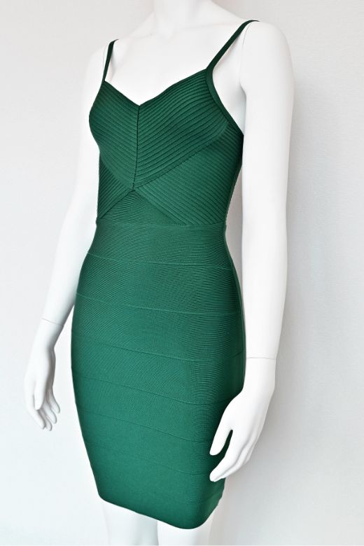Woman wearing a figure flattering Jene Bandage Dress - Emerald Green BODYCON COLLECTION