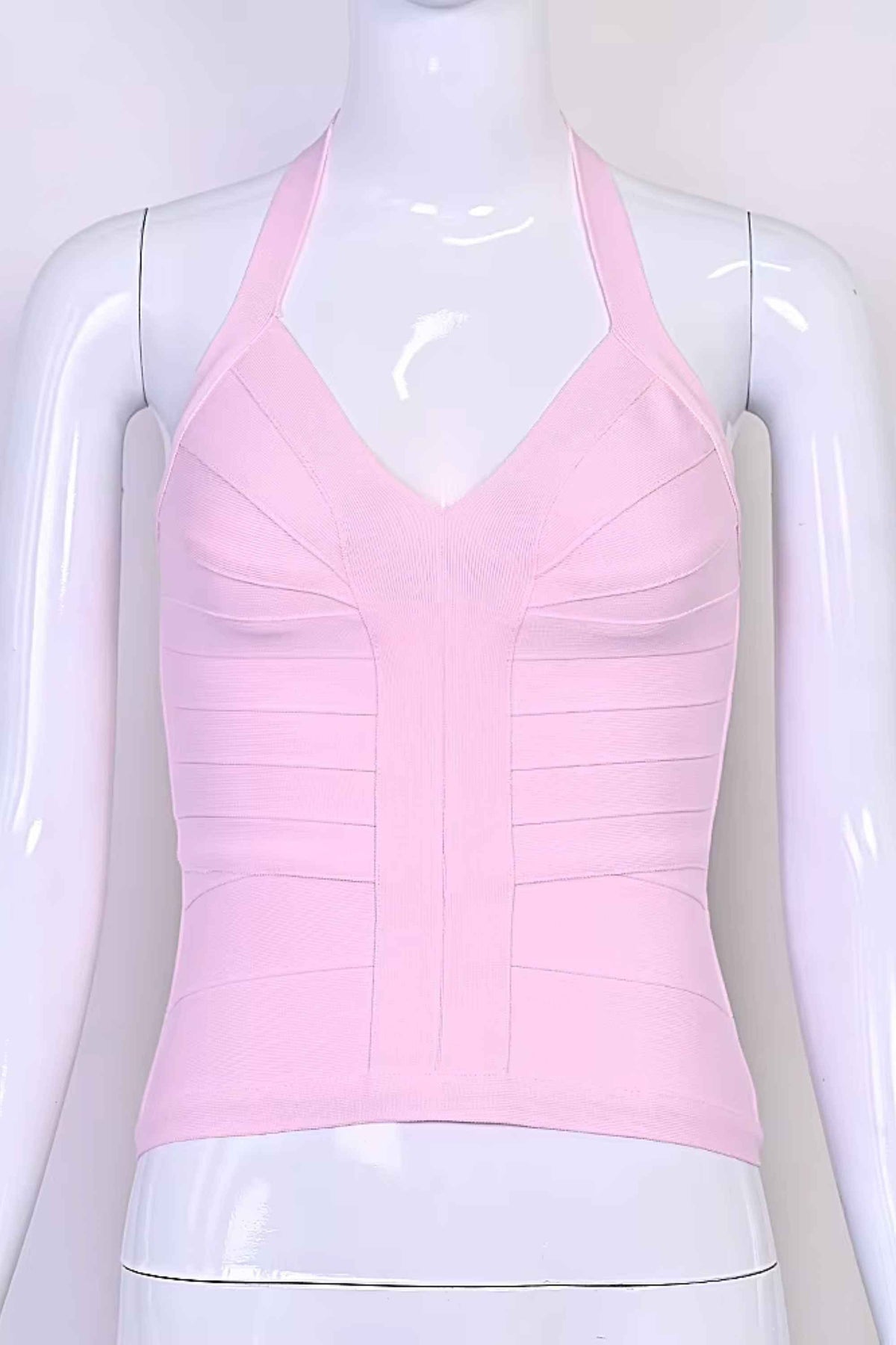 Woman wearing a figure flattering Jenna Bandage Top - Dusty Pink BODYCON COLLECTION Pty Ltd