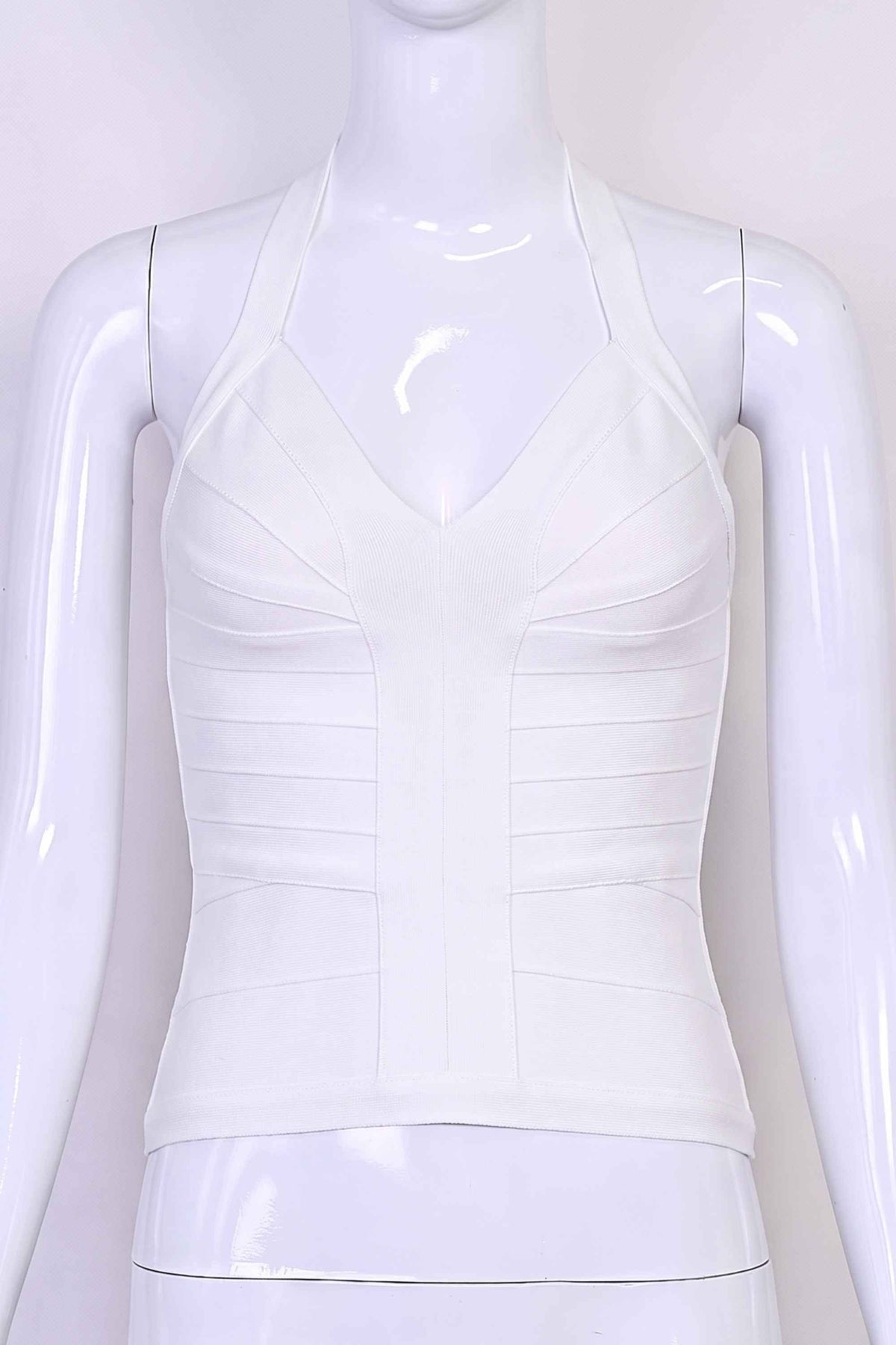 Woman wearing a figure flattering Jenna Bandage Top - White Pearl BODYCON COLLECTION Pty Ltd
