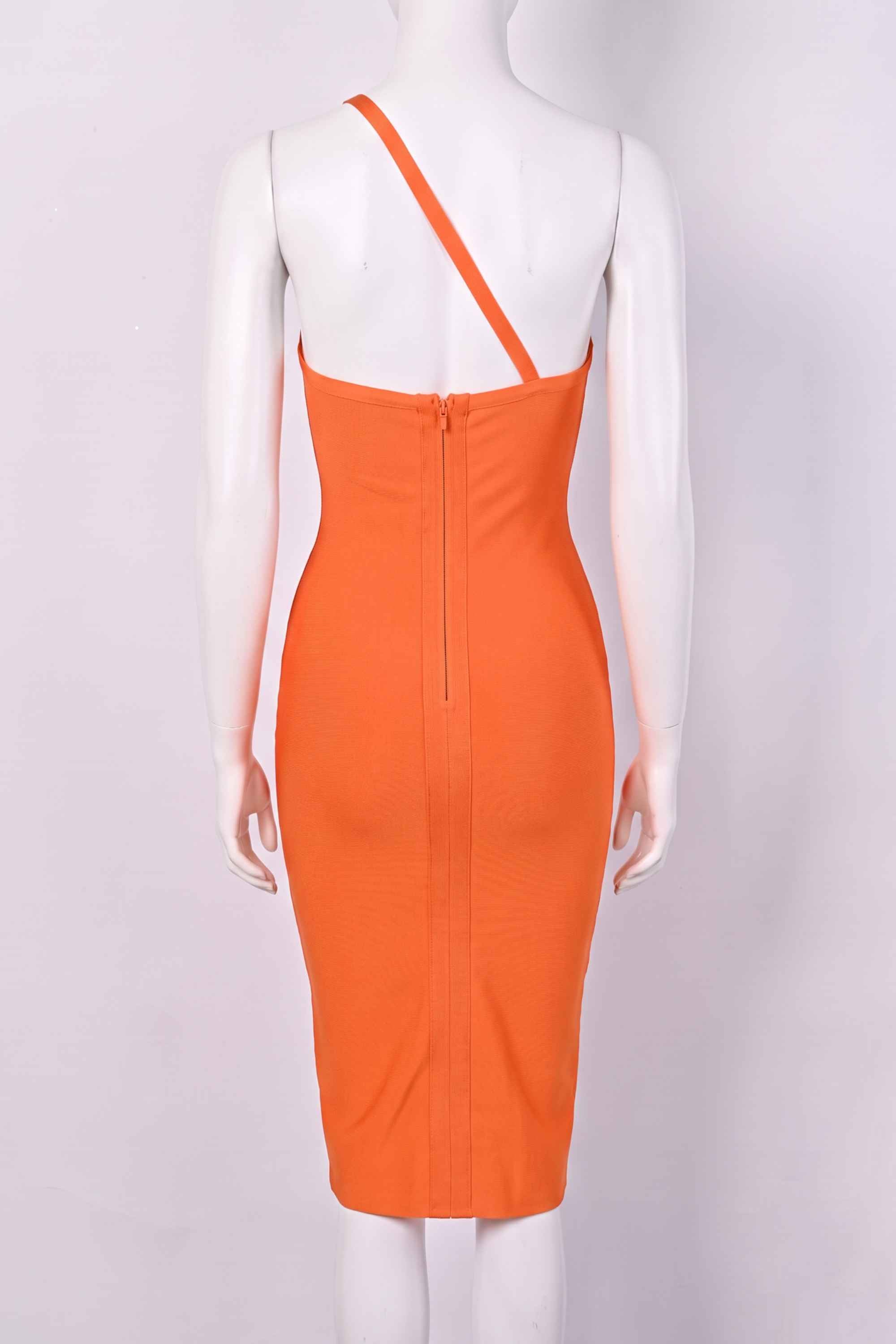 Woman wearing a figure flattering Joi Bodycon Midi Dress - Apricot Orange Bodycon Collection