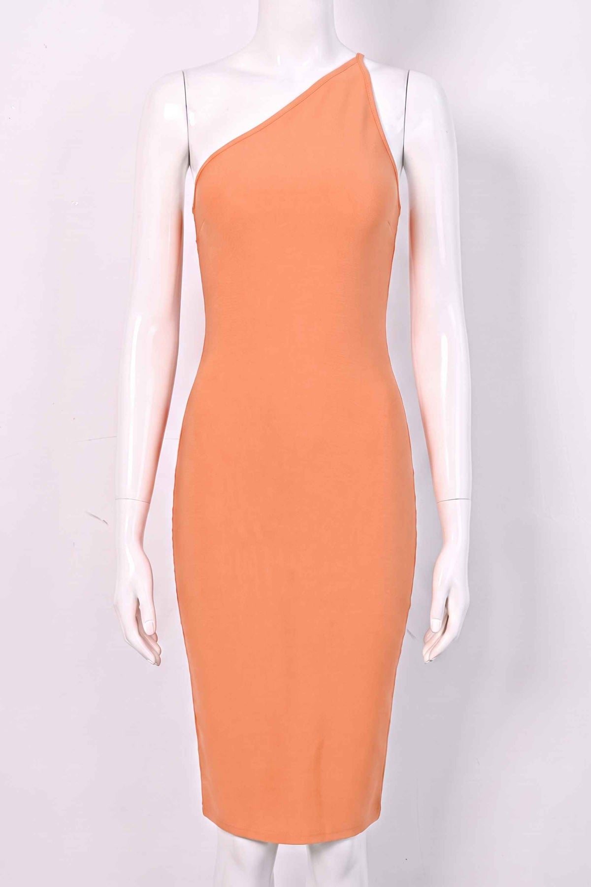 Woman wearing a figure flattering Joi Bodycon Midi Dress - Peach Bodycon Collection