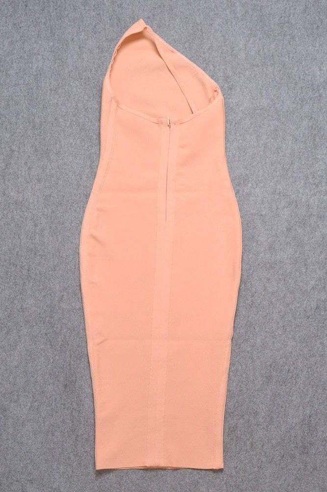 Woman wearing a figure flattering Joi Bodycon Midi Dress - Peach Bodycon Collection