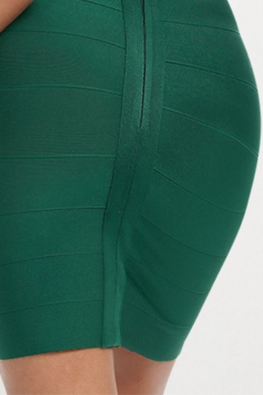 Woman wearing a figure flattering Josie Bandage V Neck Mini Dress - Emerald Green BODYCON COLLECTION