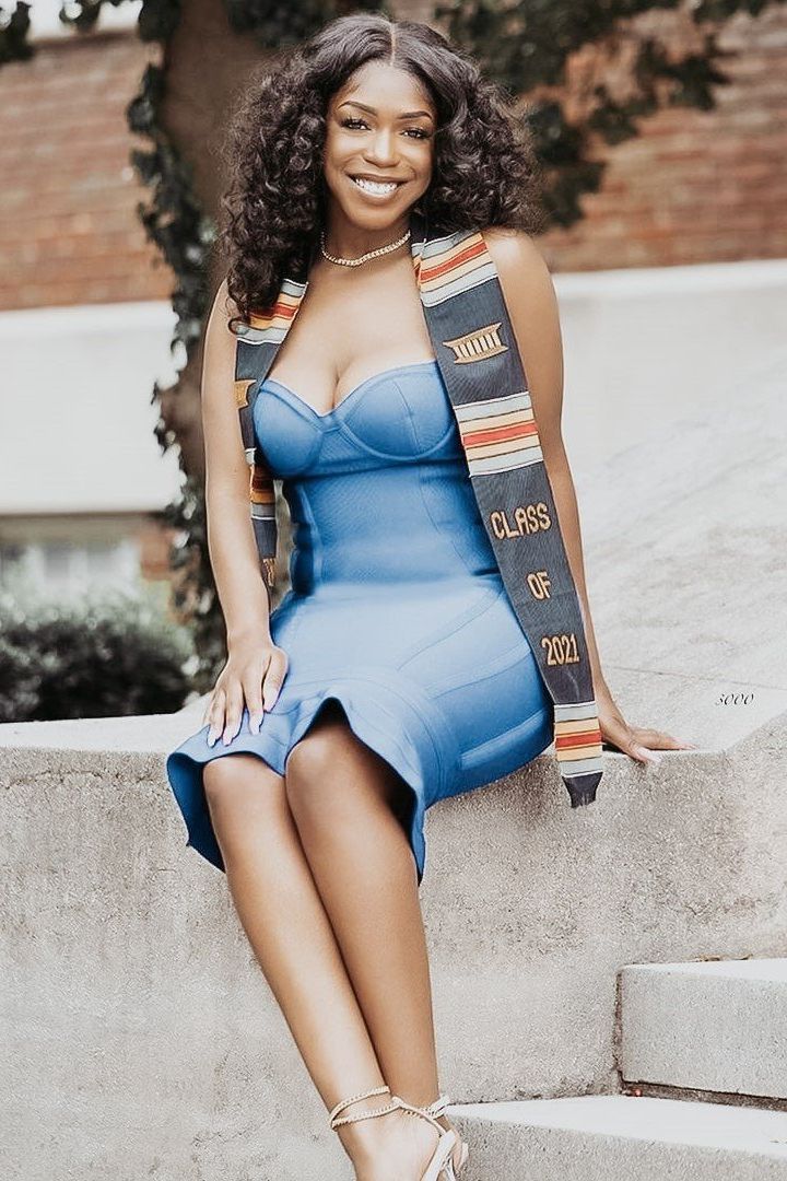 Woman wearing a figure flattering Joy Bandage Midi Dress - Red Wine Bodycon Collection