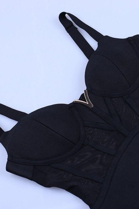 Woman wearing a figure flattering Juliette Bodycon Dress - Classic Black Bodycon Collection