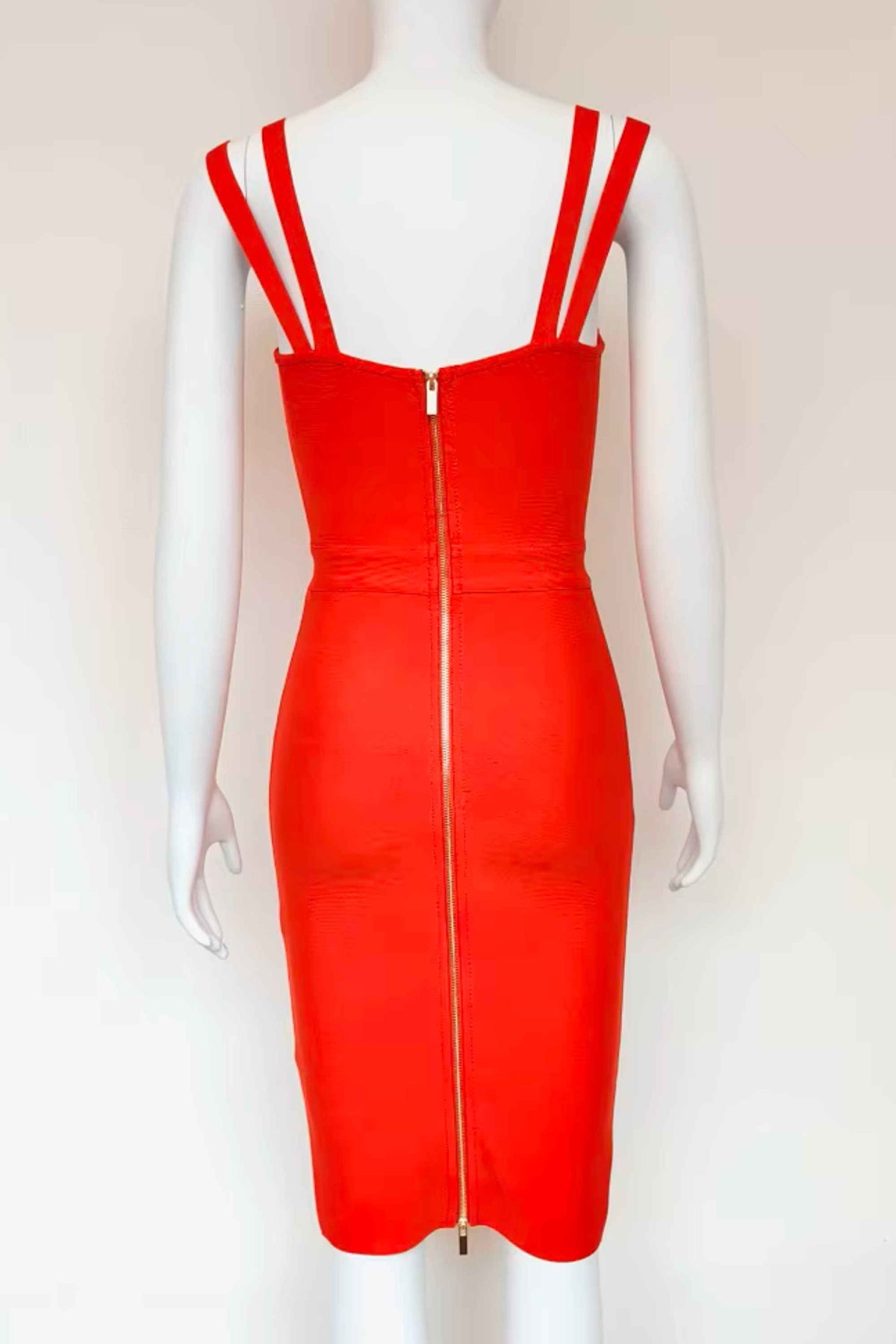 Woman wearing a figure flattering Kate Bandage Dress - Lipstick Red Bodycon Collection