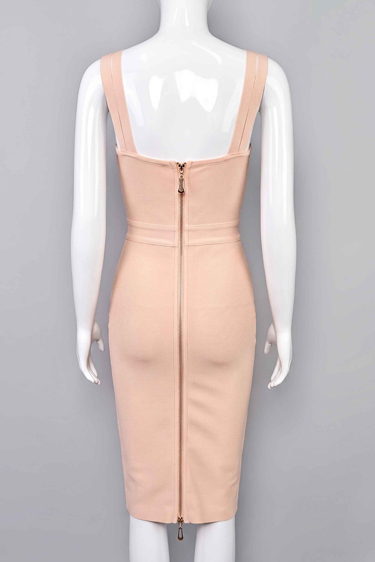 Woman wearing a figure flattering Kate Bandage Dress - Nude Bodycon Collection