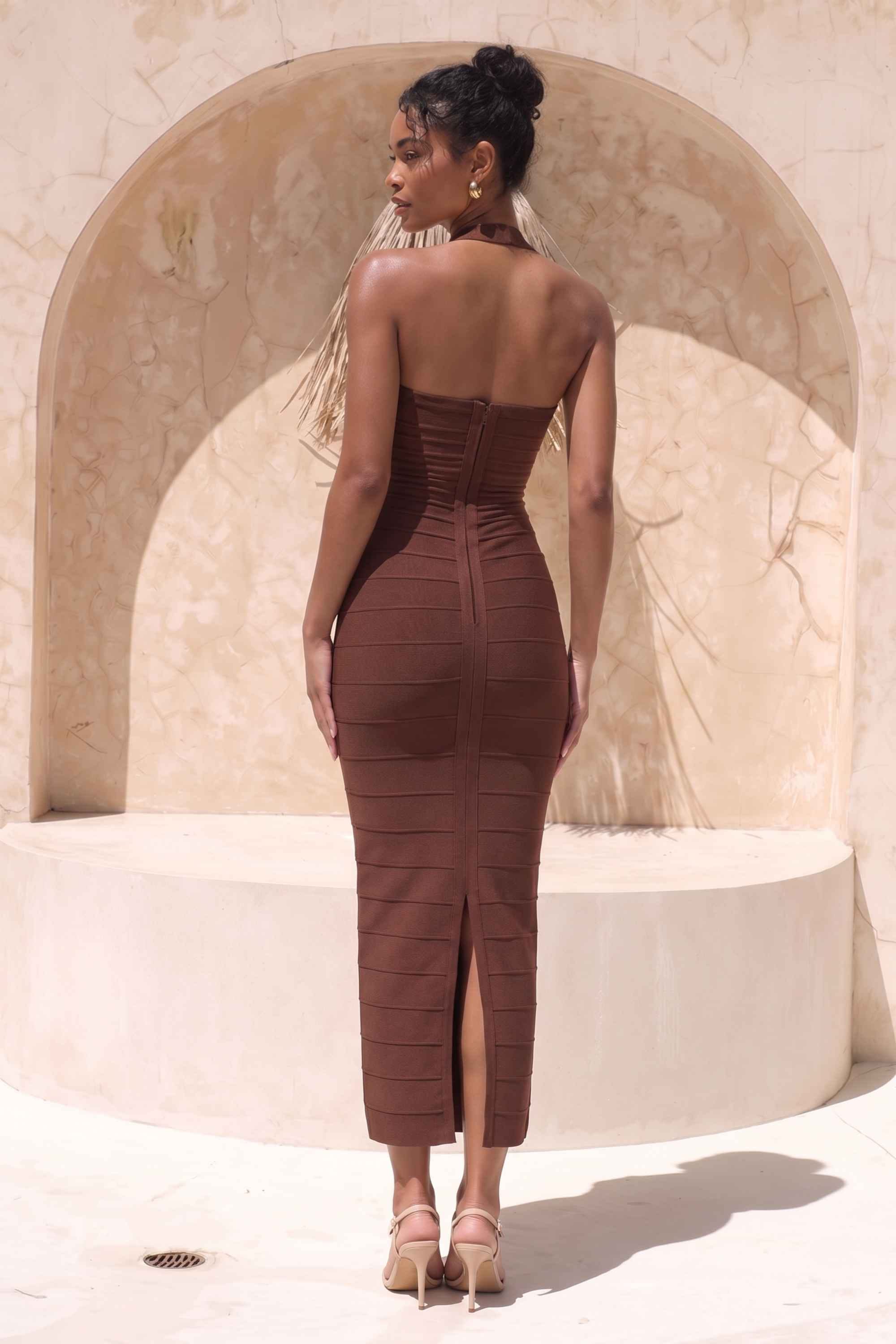 Woman wearing a figure flattering Kia Bandage Maxi Dress - Chocolate Brown BODYCON COLLECTION Pty Ltd