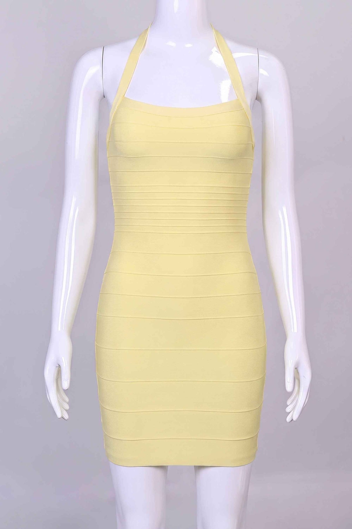 Woman wearing a figure flattering Kia Bandage Mini Dress - Butter Yellow BODYCON COLLECTION Pty Ltd