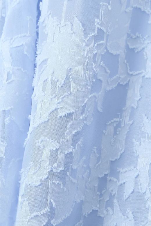 Woman wearing a figure flattering Kora Bodycon Maxi Dress - Baby Blue BODYCON COLLECTION