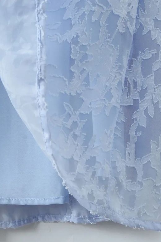 Woman wearing a figure flattering Kora Bodycon Maxi Dress - Baby Blue BODYCON COLLECTION