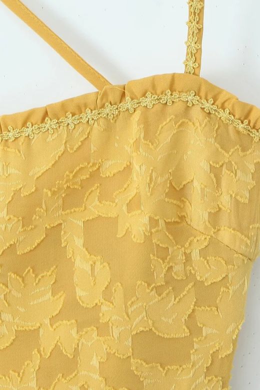 Woman wearing a figure flattering Kora Bodycon Maxi Dress - Lemon Yellow BODYCON COLLECTION