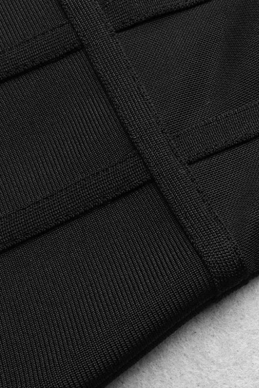 Woman wearing a figure flattering Leah Bodycon Dress - Classic Black Bodycon Collection