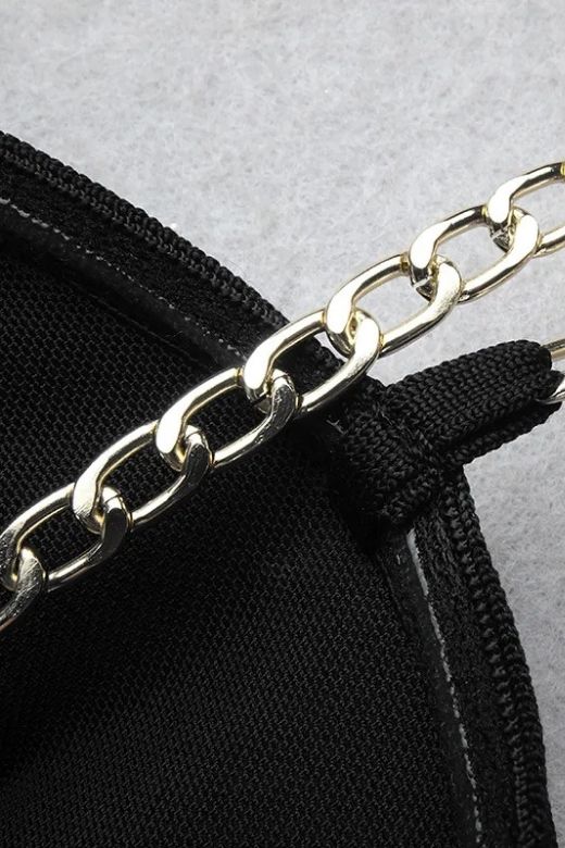 Woman wearing a figure flattering Leah Bodycon Dress - Classic Black Bodycon Collection