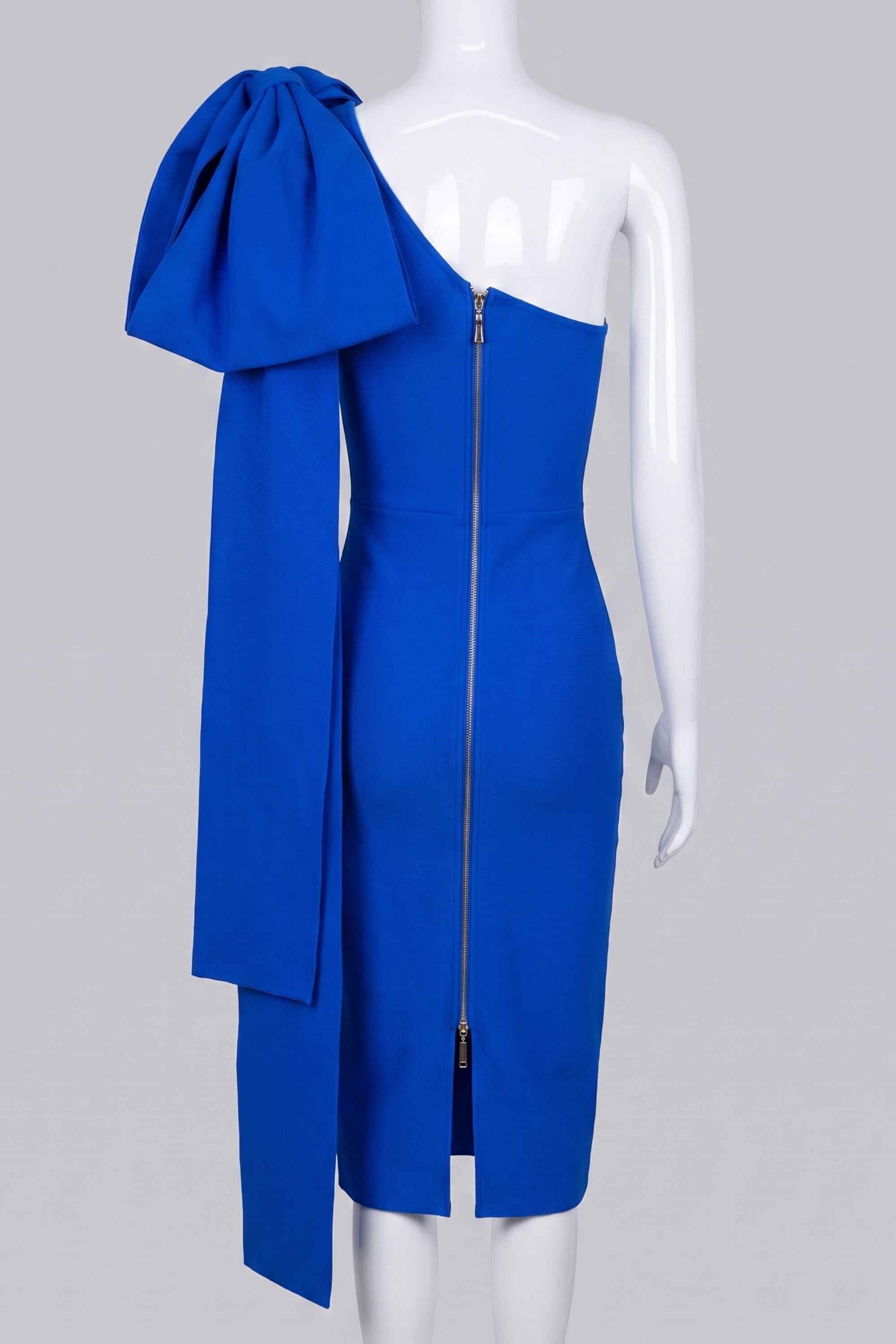 Woman wearing a figure flattering Lela Long Sleeve Bandage Midi Dress - Royal Blue BODYCON COLLECTION