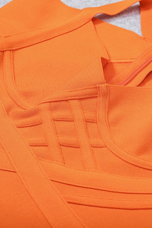 Woman wearing a figure flattering Leo Bandage Midi Dress - Apricot Orange Bodycon Collection