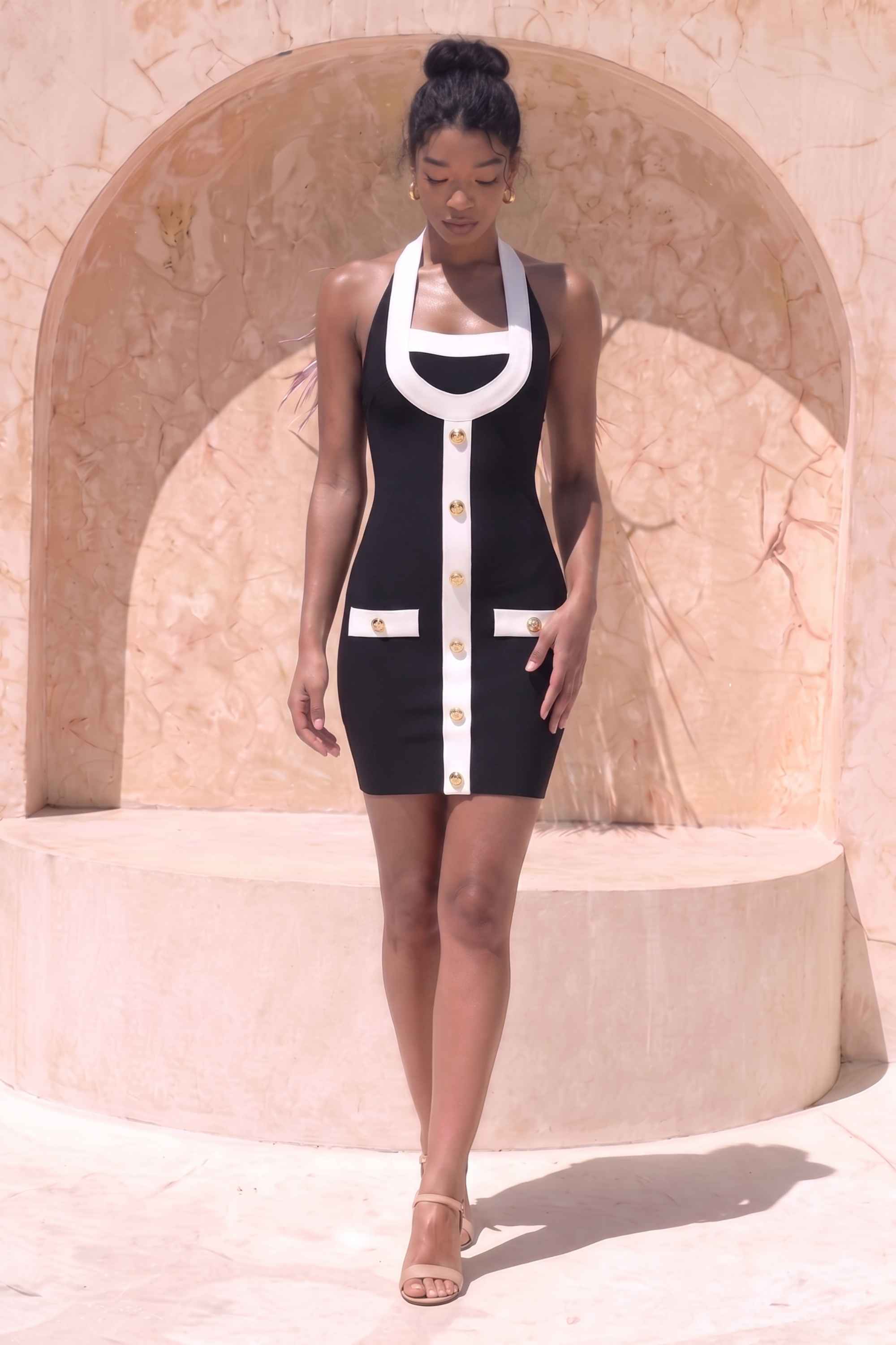 Woman wearing a figure flattering Leone Bandage Mini Dress - Classic Black BODYCON COLLECTION Pty Ltd