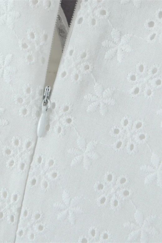 Woman wearing a figure flattering Mari Bodycon Mini Dress - Pearl White BODYCON COLLECTION