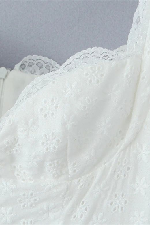 Woman wearing a figure flattering Mari Bodycon Mini Dress - Pearl White BODYCON COLLECTION