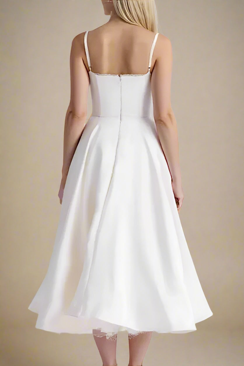 Woman wearing a figure flattering  Mavis Bodycon Midi Dress - Cream BODYCON COLLECTION