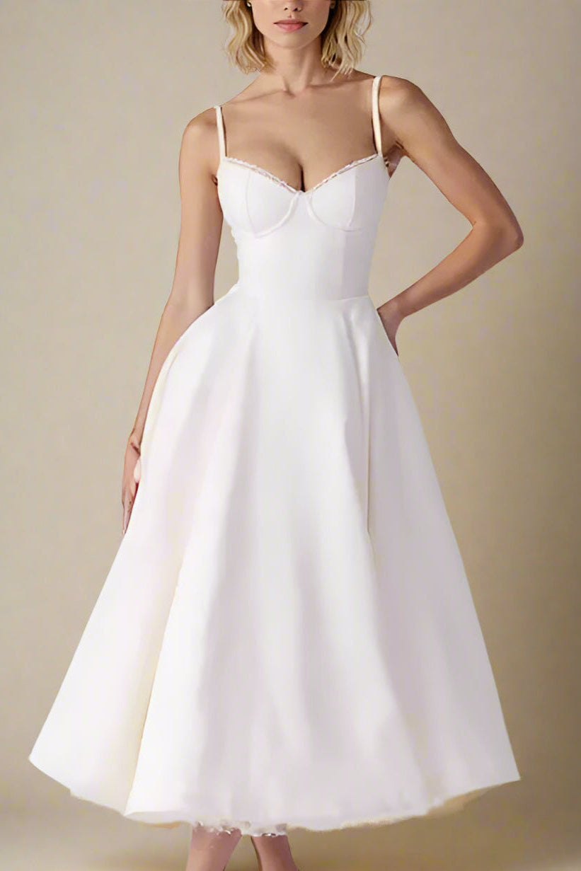 Woman wearing a figure flattering  Mavis Bodycon Midi Dress - Cream BODYCON COLLECTION